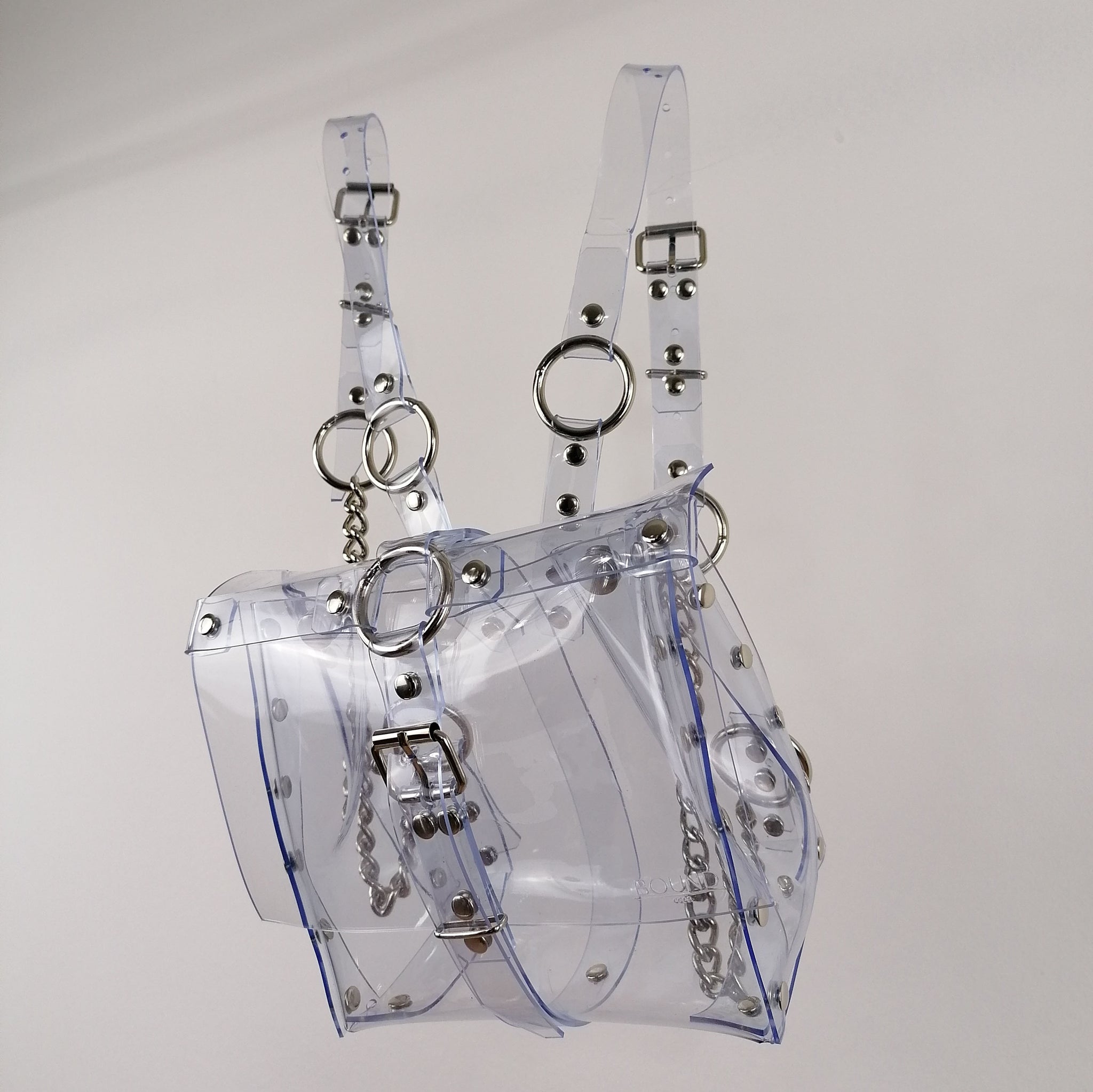 'ALJA' clear PVC backpack with chains and cross detail